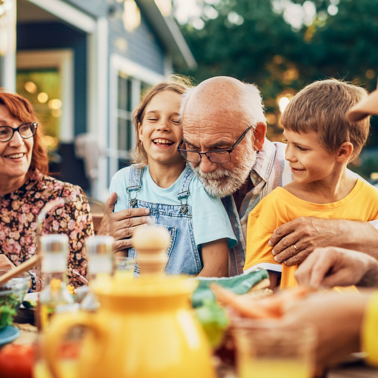 family in Raleigh together outside eating.
